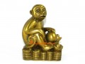 Brass Monkey on Bed of Coins and Gold Ingots